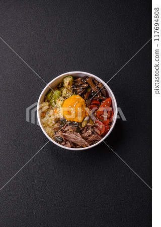 Bowl of food with beef, bulgur, tomatoes, mushrooms, zucchini 117694808