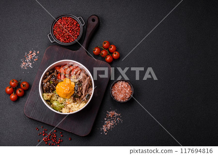 Bowl of food with beef, bulgur, tomatoes, mushrooms, zucchini 117694816