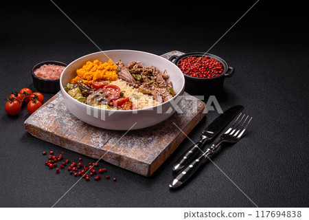 Bowl of food with beef, bulgur, tomatoes, mushrooms, zucchini 117694838