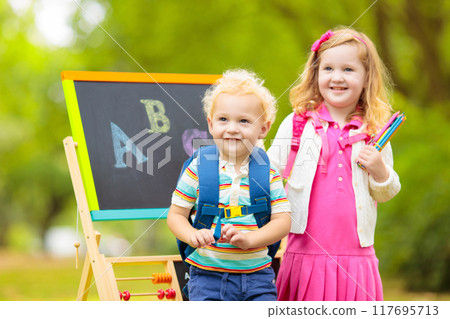 Children happy to be back to school 117695713