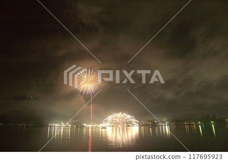 Fireworks reflected on the water Mount Fuji and fireworks at Lake Kawaguchi Fireworks reflected on the water Mount Fuji and fireworks at Lake Kawaguchi 117695923