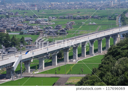 Hokuriku Shinkansen as seen from Mt. Iwanai (north direction, Sabae City) Echizen City, Fukui Prefecture 117696069