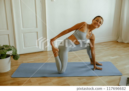 Explore a Flexible Female Yoga Practice in a Beautiful and Modern Indoor Setting Explore a Flexible Female Yoga Practice in a Beautiful and Modern Indoor Setting 117696682