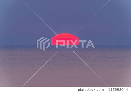 A view of the house-shaped Daruma sunset sinking into the Sea of Japan from the Byobuiwa Observatory 117698044