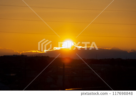 First sunrise emerging from the clouds First sunrise emerging from the clouds 117698848