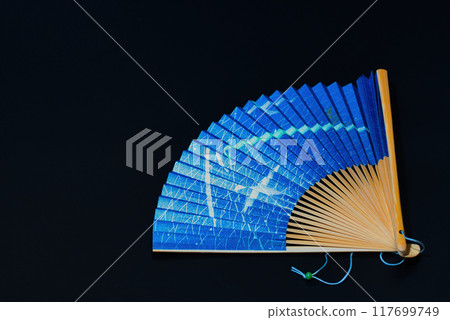 Japanese clothing accessory, folding fan, black background 117699749