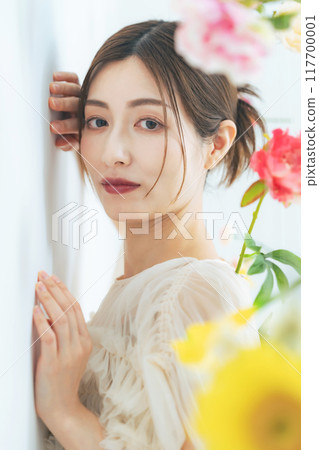 Portrait of a middle-aged woman surrounded by flowers 117700001