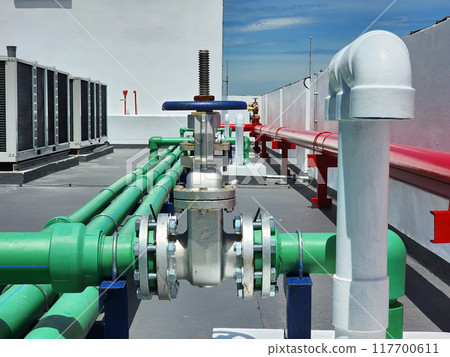 Water pipes and water tanks on the building Water pipes and water tanks on the building 117700611