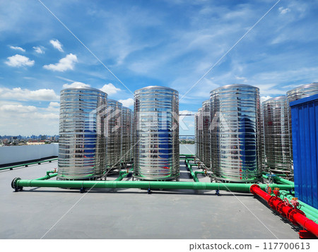 Water pipes and water tanks on the building 117700613