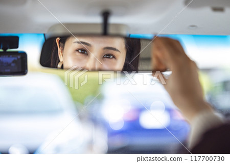 A woman on the room mirror A woman on the room mirror 117700730