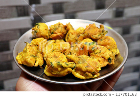 Popular street food item mix bhajiya snacks or Pakoda or Pakora Popular street food item mix bhajiya snacks or Pakoda or Pakora 117701168