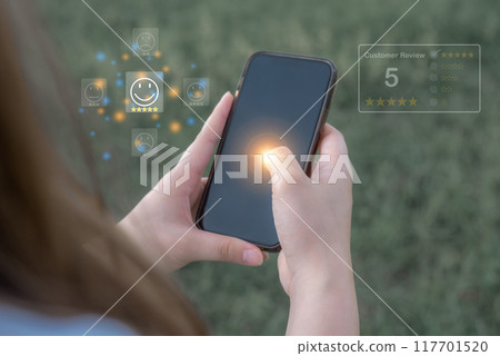 Excellence Review, Hand young woman Uses, Holding, smartphone mobile with five star to review Excellence Review, Hand young woman Uses, Holding, smartphone mobile with five star to review 117701520