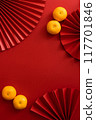 Chinese new year background design flat lay image with mandarin oranges and red paper fan 117701846