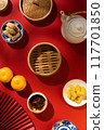 Flat lay of chinese new year items with an empty steam bowl for design use  117701850