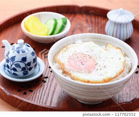 A simple fried egg bowl (rice topped with a fried egg) is fine. 117702552