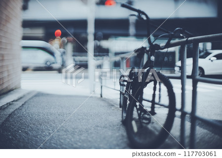 Bicycle parked on the side of the road Bicycle parked on the side of the road 117703061