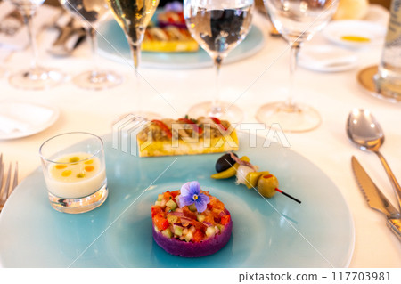 A gorgeously presented appetizer for a full-course meal 117703981