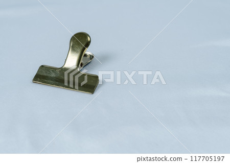 Metal clip on white background 117705197