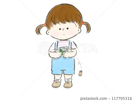 A girl with tied hair picking up a lot of acorns 117705318
