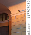 Architectural detail of the facade of a building in the evening 117707089