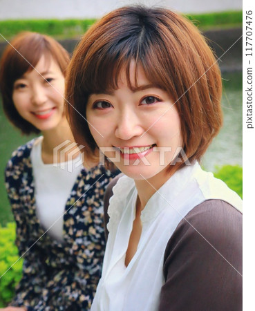Close-up of a smiling woman - AI generation 117707476