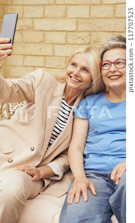 Joyful Friendship Capturing Beautiful and Memorable Moments in a Fun Selfie Experience 117707525