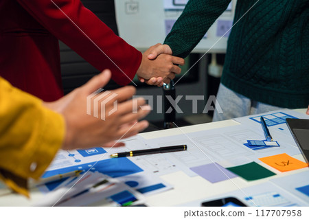 UX developer and ui designer brainstorming about mobile app interface wireframe design with customer breif and color code, User experience concept UX developer and ui designer brainstorming about mobile app interface wireframe design with customer breif and color code, User experience concept 117707958