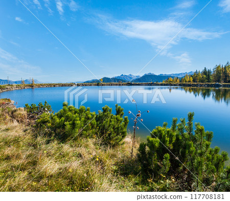 Peaceful autumn Alps mountain lake with clear transparent water and reflections. Reiteralm, Steiermark, Austria. 117708181