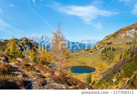 Autumn alpine Grosser Paarsee or Paarseen lake, Land Salzburg, Austria. Alps Hochkonig rocky mountain group view in far. Autumn alpine Grosser Paarsee or Paarseen lake, Land Salzburg, Austria. Alps Hochkonig rocky mountain group view in far. 117708311