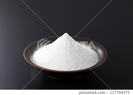 Salt on a plate 117708575