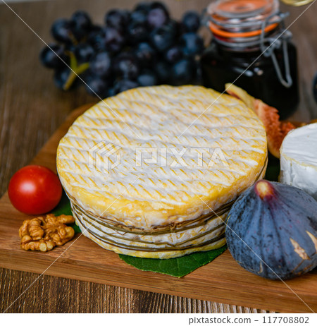Selection of French cheeses from Normandy, AOP, Livarot, Neufchatel, Pont l'eveque, Rye bread, figs Selection of French cheeses from Normandy, AOP, Livarot, Neufchatel, Pont l'eveque, Rye bread, figs 117708802