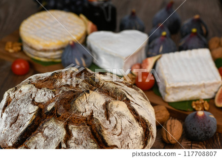 Selection of French cheeses from Normandy, AOP, Livarot, Neufchatel, Pont l'eveque, Rye bread, figs Selection of French cheeses from Normandy, AOP, Livarot, Neufchatel, Pont l'eveque, Rye bread, figs 117708807