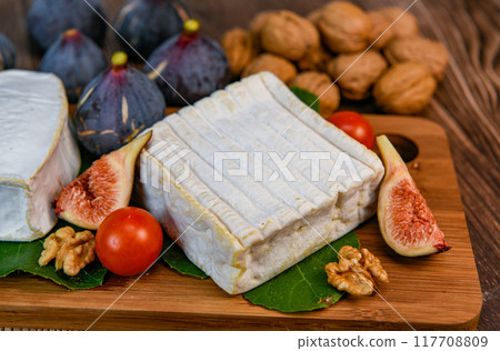 Selection of French cheeses from Normandy, AOP, Livarot, Neufchatel, Pont l'eveque, Rye bread, figs Selection of French cheeses from Normandy, AOP, Livarot, Neufchatel, Pont l'eveque, Rye bread, figs 117708809