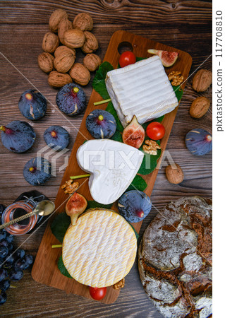 Selection of French cheeses from Normandy, AOP, Livarot, Neufchatel, Pont l'eveque, Rye bread, figs Selection of French cheeses from Normandy, AOP, Livarot, Neufchatel, Pont l'eveque, Rye bread, figs 117708810