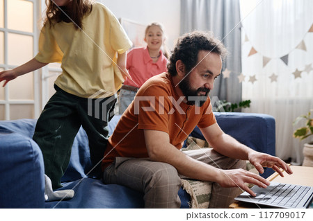 Engaging in Online Activities with Kids on Couch Engaging in Online Activities with Kids on Couch 117709017