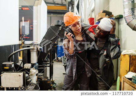 Helping Colleague in Industrial Factory 117710720