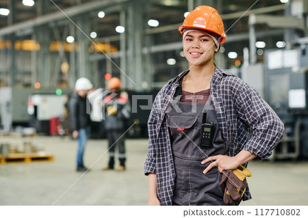 Portrait of Smiling Worker Wearing Safety Helmet Portrait of Smiling Worker Wearing Safety Helmet 117710802