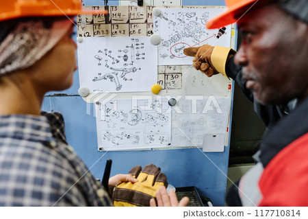 Discussing Engineering Schematics with Team Discussing Engineering Schematics with Team 117710814