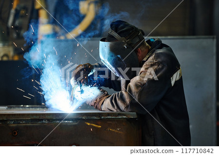 Performing Metal Welding in Industrial Environment Performing Metal Welding in Industrial Environment 117710842