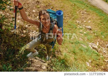An Adventurous Hiker Climbing and Scaling a Rugged Rocky Trail in the Great Outdoors An Adventurous Hiker Climbing and Scaling a Rugged Rocky Trail in the Great Outdoors 117710924