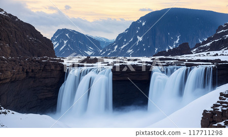A large waterfall in winter covered with snow. 117711298
