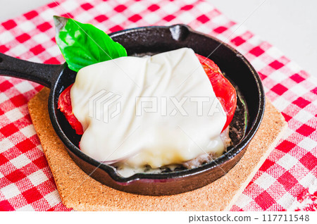 Making cheese hamburger steak in a skillet 117711548