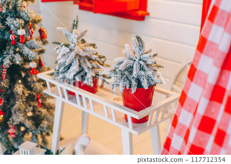 Close up photo of Christmas decorations in white and red colors. Merry Christmas and Happy New Year. Close up photo of Christmas decorations in white and red colors. Merry Christmas and Happy New Year. 117712354