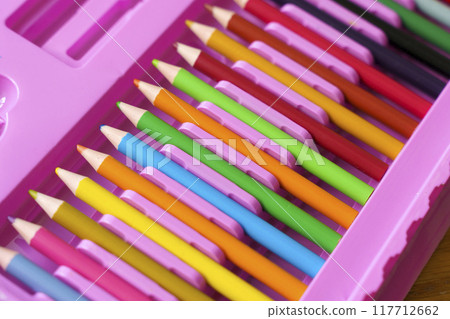 Set of colored pencils in a school pencil case for drawing. Children's colored pencils in a pencil case for schoolchildren Set of colored pencils in a school pencil case for drawing. Children's colored pencils in a pencil case for schoolchildren 117712662