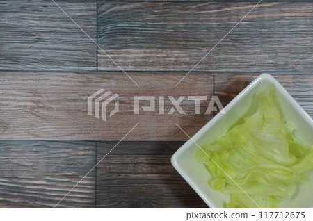 Salad on a wooden background Salad on a wooden background 117712675