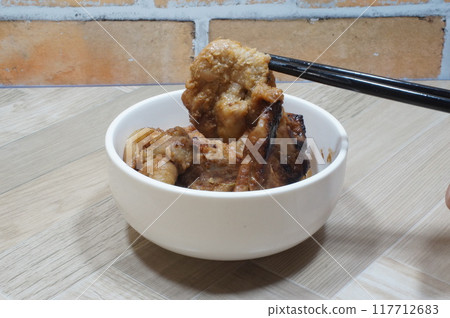 Chopsticks and ginger pork 117712683