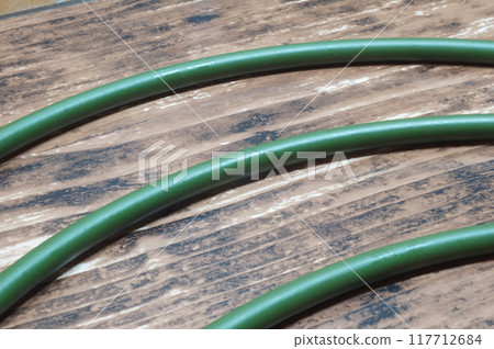 Arched pillars on a wood grain background 117712684