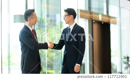 A businessman shaking hands A businessman shaking hands 117712901