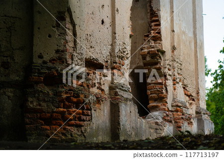 A dilapidated church. Bullet marks in the brick wall. Survived the war 117713197