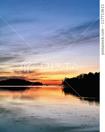 Sailing during sunset. Sundbyholm, Sweden 117713613